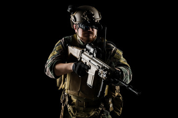 US marine corps soldier with weapon. Shot in studio. isolated with clipping on black background.