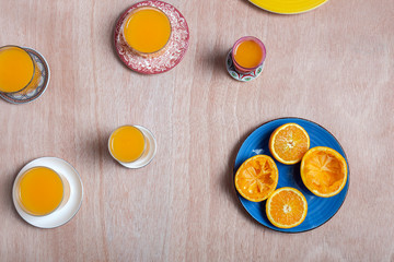 Homemade orange juice from above on wooden table