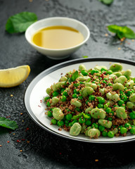Vegan Green broad beans and quinoa salad with sweet peas and mint. Healthy food.