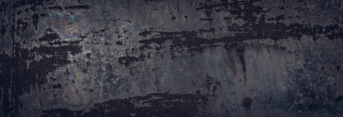 Brutal metal texture for a dark rough background. Some rainbow stains and rust