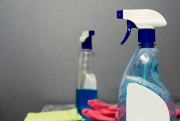 container with a sprayer for washing windows
