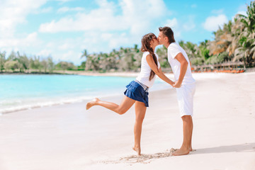 Young couple on white beach during summer vacation.
