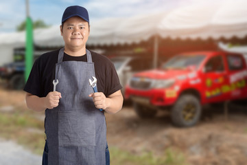 Male Auto mechanic hand holding wrench