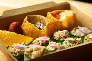 Sushi box with nigiris and tofu bags 