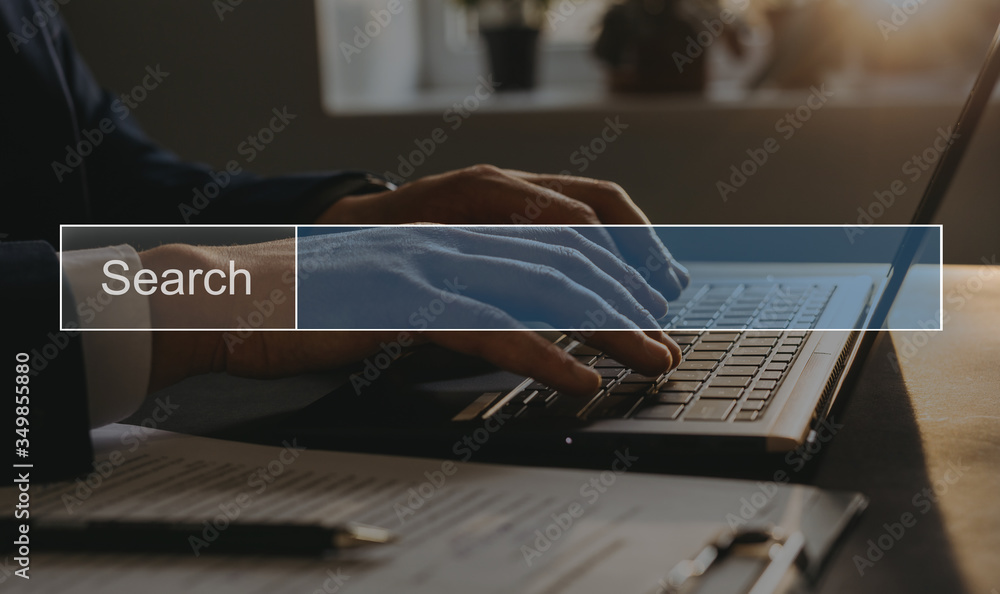 Aufkleber BusinessMan tapping laptop keyboard and search page on computer touch screen.SEO Concept Searching. Copy space.