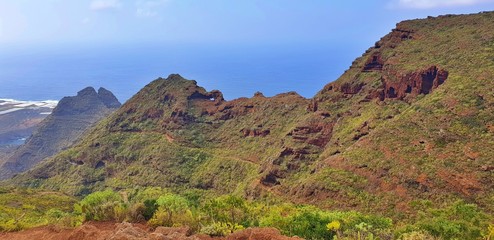 Mountains in front of the ocean