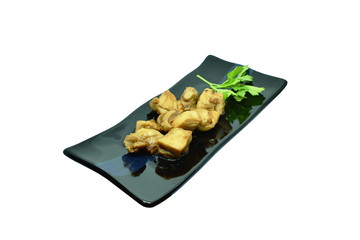 roasted slice chicken dressing Japanese teriyaki sauce and Chinese celery on plate