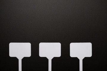 mockup for price tags, labels. Three white nameplates on a black background