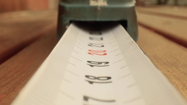 Roll of measuring tape in motion macro