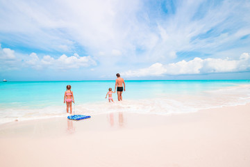 Happy beautiful family on a tropical beach vacation