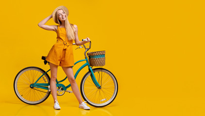 Fototapeta na wymiar Summer Plans. Pensive Cute Teen Girl Standing Next To Vintage Bike