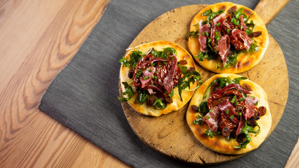 Mini Pizza with spanish ham in italy