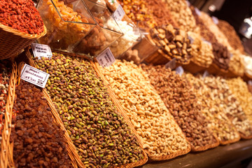 nuts and dried fruits on the counter in the market