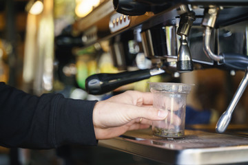 Pouring hot water from coffee blending machine