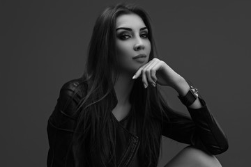 High fashion portrait of young elegant woman. Black and white image