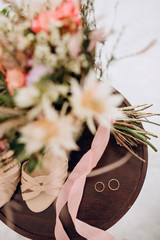 bride's bouquet, shoes, wedding rings and a set of invitations. The bride's accessories. Wedding morning.