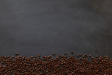 coffee bean on black wooden table background. top view
