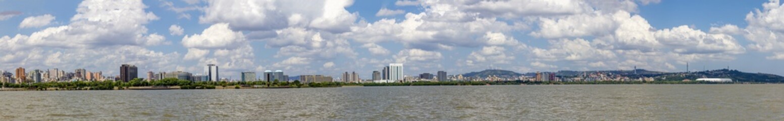 Fototapeta premium Panorama of Guaiba shore with trees and buildings