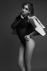 Fashion girl posing. Black and white photography.