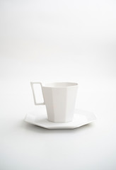 New geometric mug modern style with cubic edges. Serving for store catalog. Isolated white background. Hot drinks tea or coffee.