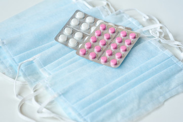 These are Tablets and Disposable medical Masks. Macro Photo. Pharmaceuticals And Medicine.