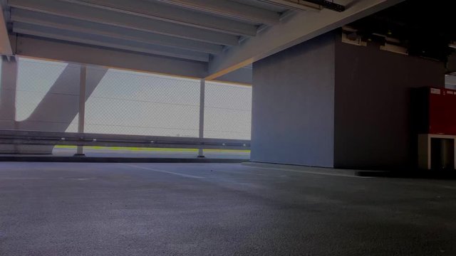 panning over empty parking garage with view on bright surroundings