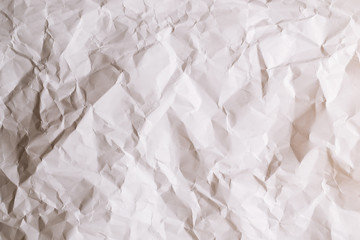 Crumpled white paper background.
