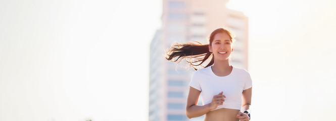 smiling Asian Young fitness sport woman running  and Sportive people training in a urban area, healthy lifestyle and sport concepts. © tuiphotoengineer