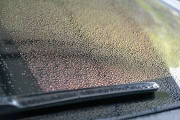 Water droplets on the windscreen after washing the car. Water droplets on the glass. Water droplets isolated on background. Abstract and Blur water droplets background.