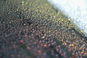 Water droplets on the windscreen after washing the car and abstract and blurred water droplets background