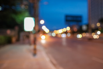 Blurred defocused lights of heavy traffic. Abstract blur image of night light bokeh on street. Blur traffic road with colorful bokeh light. Copy space of  transportation and travel concept.