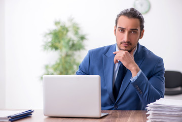 Young male businessman working in the office