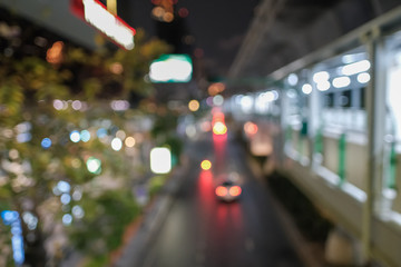 Blurred defocused lights of heavy traffic. Abstract blur image of night light bokeh on street. Blur traffic road with colorful bokeh light. Copy space of transportation and travel concept.