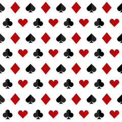 Playing card suits:  spade, diamond, heart and club for your design. Vector icons seamless pattern isolated on white background.