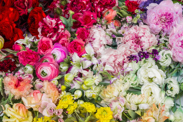 Floral background. Lot of  Decoration artificial flowers in colorful composition