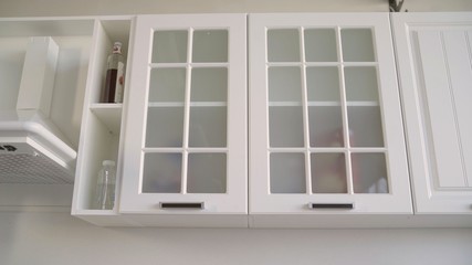 Cupboard part of a white kitchen set. Kitchen white kit. In the West, modern residential kitchen. White cupboard in the kitchen headset.
