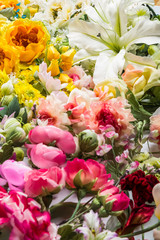 Floral background. Lot of  Decoration artificial flowers in colorful composition