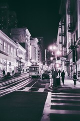San Francisco street scene with cablecar at night