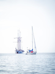 two yachts on the water coloured photo
