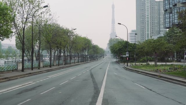 Paris, France / 04 13 2020: Deserted road leading to Eiffel tower during coronavirus / Covid-19 lockdown in Paris, france 4K