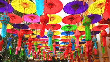Fototapeta na wymiar Thai multi color handicraft weaving,paper lantern,paper umbrella for decorate in religious place.