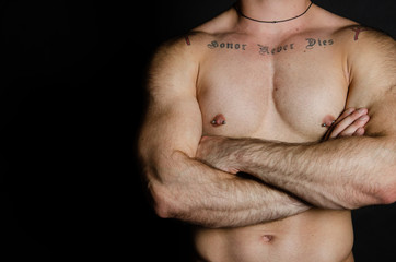 Naklejka premium Young attractive man. Sport and healthy lifestyle. Strong arms.