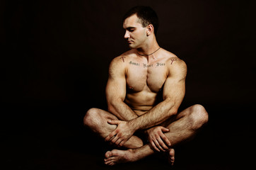 Obraz na płótnie Canvas Young muscular man. Recreation and sports. 