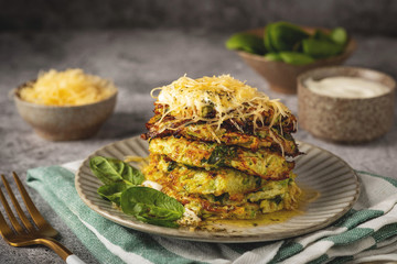 zucchini and spinach pancakes with cheese, close-up