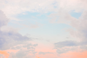 Warm summer or spring light neon-colored sunset or sunrise sky with moon