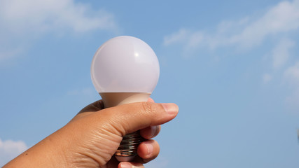 light bulb in hands