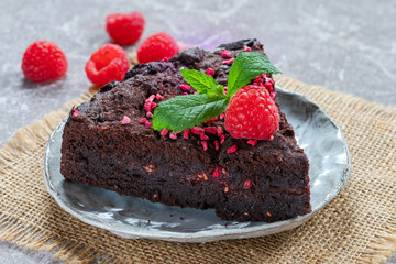 Chocolate and raspberry torte garnished with fresh fruit and mint