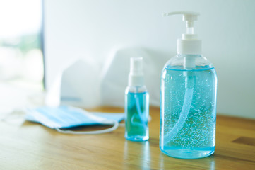 Alcohol hand gel, sanitizer spray, blue face mask and N95 mask protection against pollution flu and coronavirus. Health care and  Covid-19 concept.