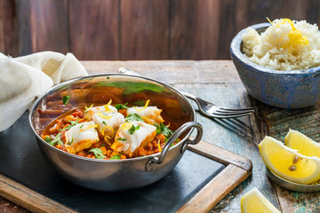 Curried cod with chickpeas, fresh coriander and rice