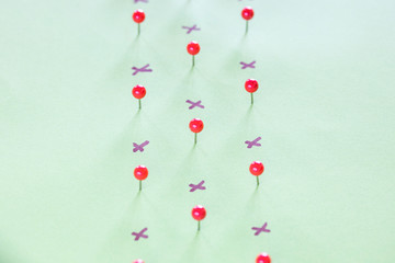 Pushpins and crosses. Social distancing concept